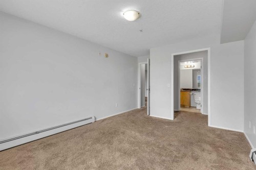 6307-304 Mackenzie Way Sw, Airdrie, AB - Indoor Photo Showing Other Room
