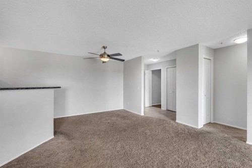 6307-304 Mackenzie Way Sw, Airdrie, AB - Indoor Photo Showing Other Room