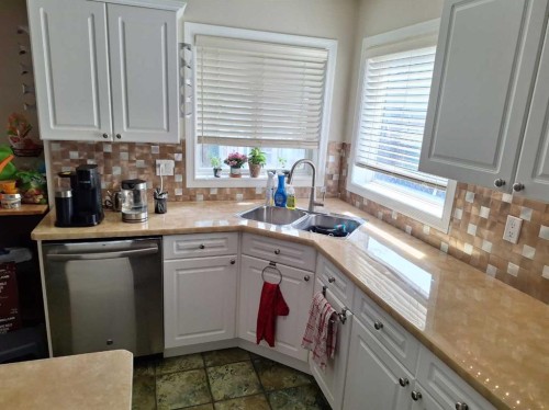 249 West Lakeview Place, Chestermere, AB - Indoor Photo Showing Kitchen With Double Sink