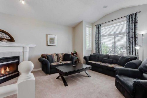 249 West Lakeview Place, Chestermere, AB - Indoor Photo Showing Living Room With Fireplace