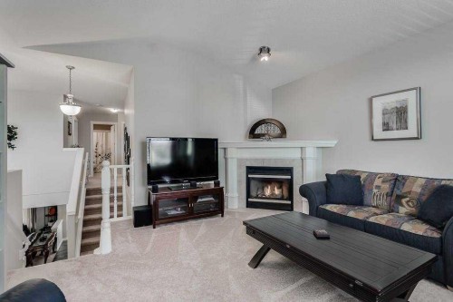 249 West Lakeview Place, Chestermere, AB - Indoor Photo Showing Living Room With Fireplace