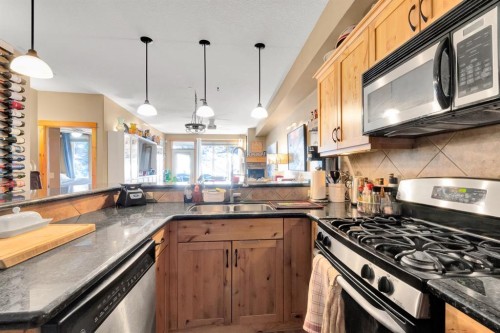 612-107 Armstrong Place, Canmore, AB - Indoor Photo Showing Kitchen With Double Sink