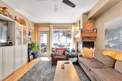 612-107 Armstrong Place, Canmore, AB - Indoor Photo Showing Living Room With Fireplace