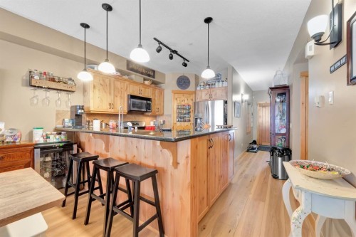 612-107 Armstrong Place, Canmore, AB - Indoor Photo Showing Kitchen With Upgraded Kitchen