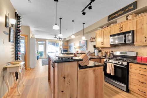 612-107 Armstrong Place, Canmore, AB - Indoor Photo Showing Kitchen With Upgraded Kitchen