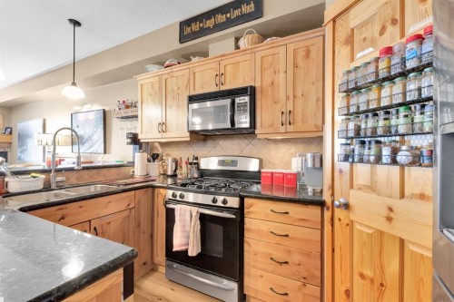 612-107 Armstrong Place, Canmore, AB - Indoor Photo Showing Kitchen With Double Sink