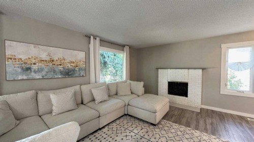 47 Sunhurst Court Se, Calgary, AB - Indoor Photo Showing Living Room With Fireplace