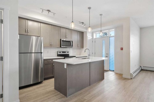 12-30 Shawnee Common Sw, Calgary, AB - Indoor Photo Showing Kitchen With Stainless Steel Kitchen With Upgraded Kitchen