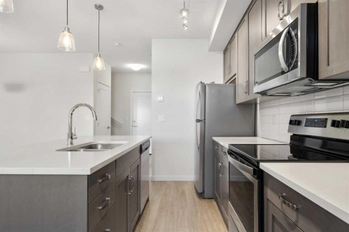 12-30 Shawnee Common Sw, Calgary, AB - Indoor Photo Showing Kitchen With Stainless Steel Kitchen With Upgraded Kitchen