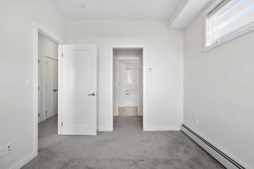 12-30 Shawnee Common Sw, Calgary, AB - Indoor Photo Showing Other Room
