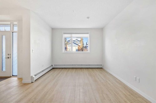 12-30 Shawnee Common Sw, Calgary, AB - Indoor Photo Showing Other Room