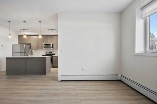 12-30 Shawnee Common Sw, Calgary, AB - Indoor Photo Showing Kitchen With Upgraded Kitchen