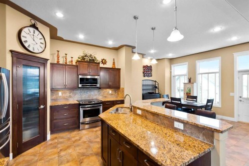 117 Kingsland Court Se, Airdrie, AB - Indoor Photo Showing Kitchen With Upgraded Kitchen