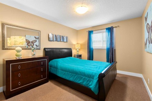 117 Kingsland Court Se, Airdrie, AB - Indoor Photo Showing Bedroom
