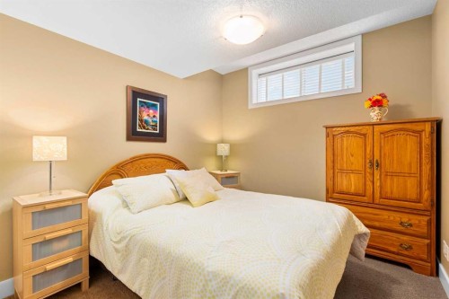 117 Kingsland Court Se, Airdrie, AB - Indoor Photo Showing Bedroom