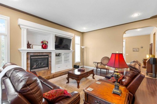 117 Kingsland Court Se, Airdrie, AB - Indoor Photo Showing Living Room With Fireplace