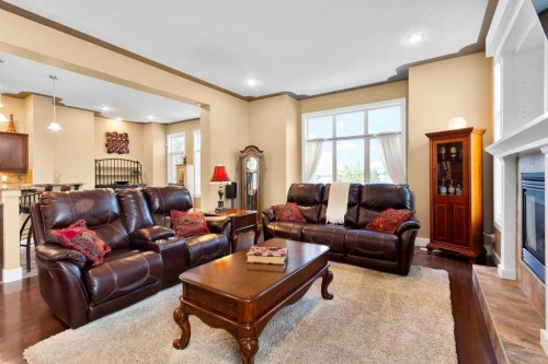 117 Kingsland Court Se, Airdrie, AB - Indoor Photo Showing Living Room With Fireplace