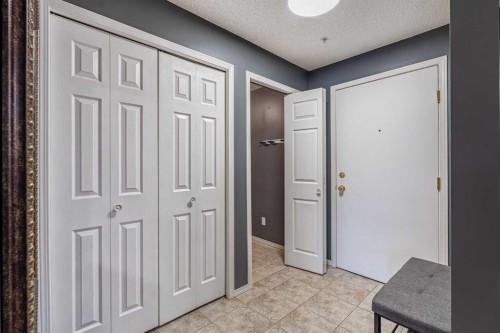 8213-304 Mackenzie Way Sw, Airdrie, AB - Indoor Photo Showing Other Room
