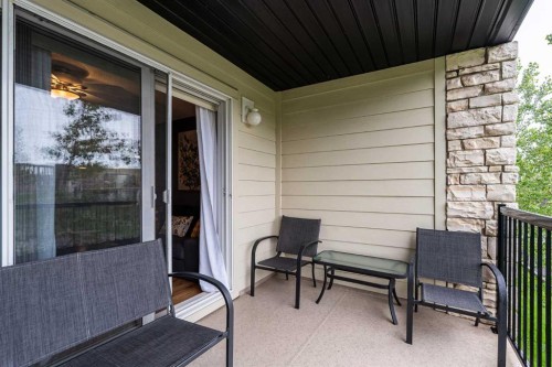 8213-304 Mackenzie Way Sw, Airdrie, AB - Outdoor With Deck Patio Veranda With Exterior