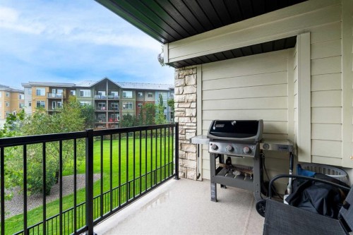8213-304 Mackenzie Way Sw, Airdrie, AB - Outdoor With Balcony With Exterior