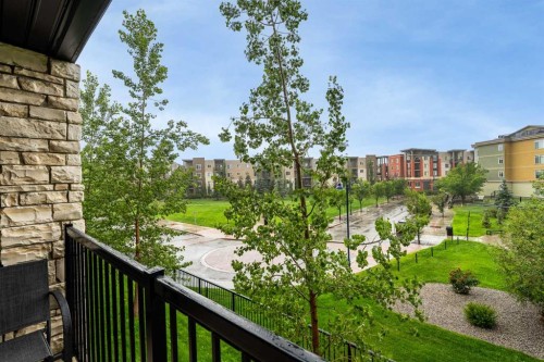 8213-304 Mackenzie Way Sw, Airdrie, AB - Outdoor With Balcony