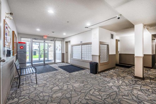 8213-304 Mackenzie Way Sw, Airdrie, AB - Indoor Photo Showing Other Room