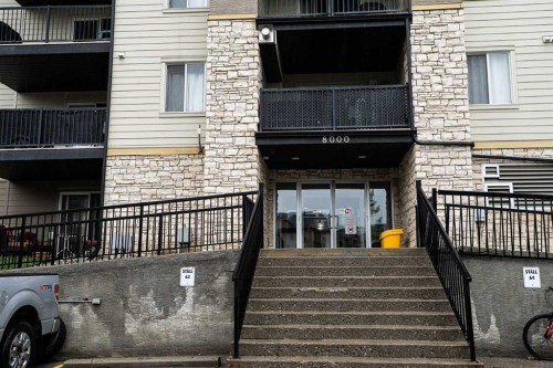 8213-304 Mackenzie Way Sw, Airdrie, AB - Outdoor With Balcony With Exterior