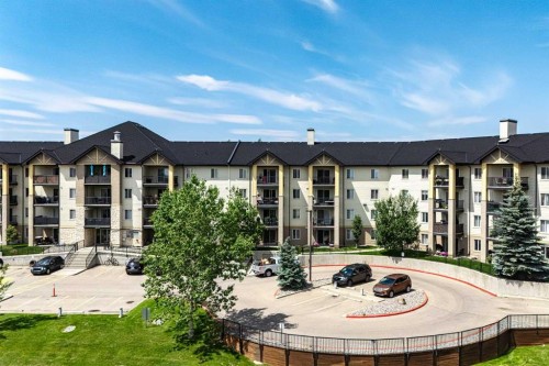 8213-304 Mackenzie Way Sw, Airdrie, AB - Outdoor With Balcony With Facade