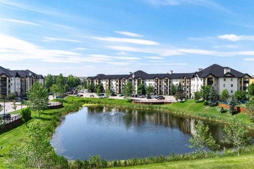 8213-304 Mackenzie Way Sw, Airdrie, AB - Outdoor With Body Of Water With View
