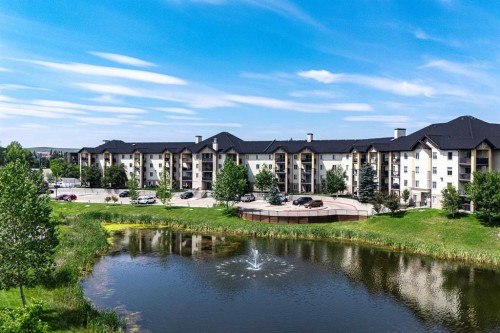 8213-304 Mackenzie Way Sw, Airdrie, AB - Outdoor With Body Of Water