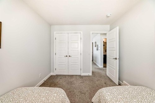 144 Evanscrest Park Nw, Calgary, AB - Indoor Photo Showing Bedroom