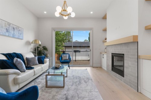 3110 40 Street Sw, Calgary, AB - Indoor Photo Showing Living Room With Fireplace
