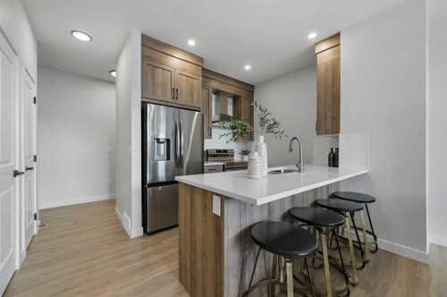 2194 Bayview Drive Sw, Airdrie, AB - Indoor Photo Showing Kitchen With Stainless Steel Kitchen