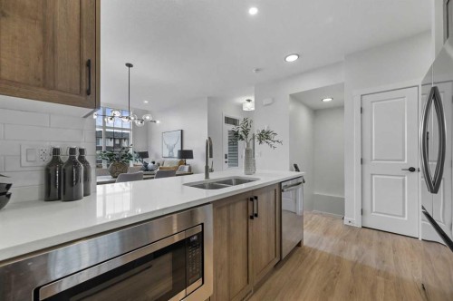 2194 Bayview Drive Sw, Airdrie, AB - Indoor Photo Showing Kitchen With Double Sink
