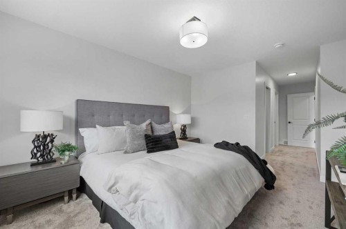 2194 Bayview Drive Sw, Airdrie, AB - Indoor Photo Showing Bedroom
