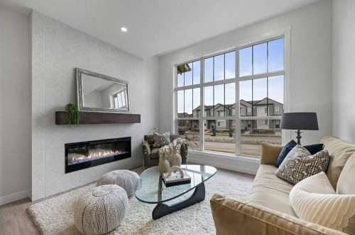 2194 Bayview Drive Sw, Airdrie, AB - Indoor Photo Showing Living Room With Fireplace