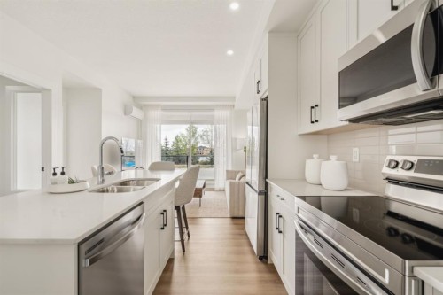 119-20 Cascade Ridge, Canmore, AB - Indoor Photo Showing Kitchen With Double Sink With Upgraded Kitchen