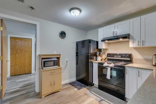 411 Rundleson Place Ne, Calgary, AB - Indoor Photo Showing Kitchen