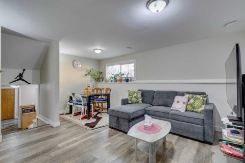 411 Rundleson Place Ne, Calgary, AB - Indoor Photo Showing Living Room