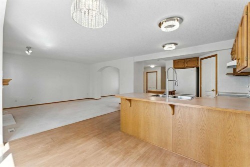 34 Tuscarora Way Nw, Calgary, AB - Indoor Photo Showing Kitchen With Double Sink