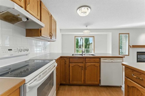 34 Tuscarora Way Nw, Calgary, AB - Indoor Photo Showing Kitchen With Double Sink
