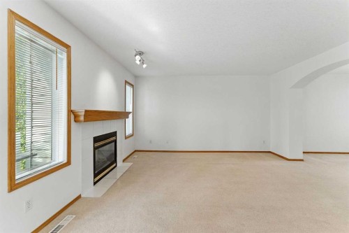 34 Tuscarora Way Nw, Calgary, AB - Indoor With Fireplace