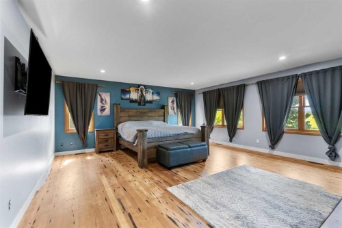 200-32075 402 Avenue West, Rural Foothills County, AB - Indoor Photo Showing Bedroom