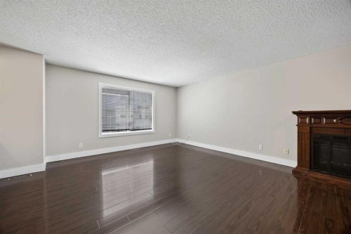 120 Prestwick Acres Lane Se, Calgary, AB - Indoor Photo Showing Other Room With Fireplace