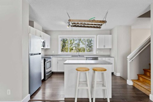 120 Prestwick Acres Lane Se, Calgary, AB - Indoor Photo Showing Kitchen With Double Sink