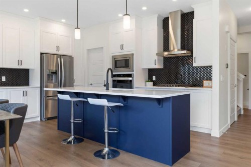 1635 Baywater Street Sw, Airdrie, AB - Indoor Photo Showing Kitchen With Upgraded Kitchen