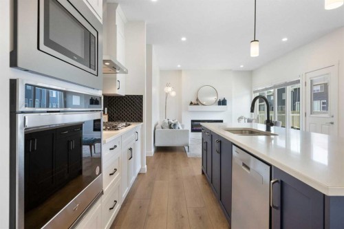 1635 Baywater Street Sw, Airdrie, AB - Indoor Photo Showing Kitchen With Upgraded Kitchen