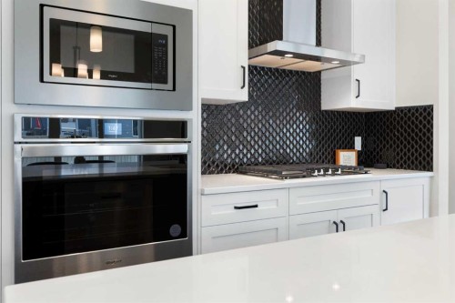 1635 Baywater Street Sw, Airdrie, AB - Indoor Photo Showing Kitchen With Upgraded Kitchen