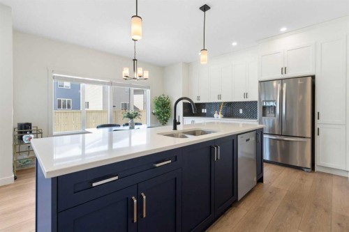 1635 Baywater Street Sw, Airdrie, AB - Indoor Photo Showing Kitchen With Double Sink With Upgraded Kitchen