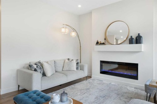 1635 Baywater Street Sw, Airdrie, AB - Indoor Photo Showing Living Room With Fireplace